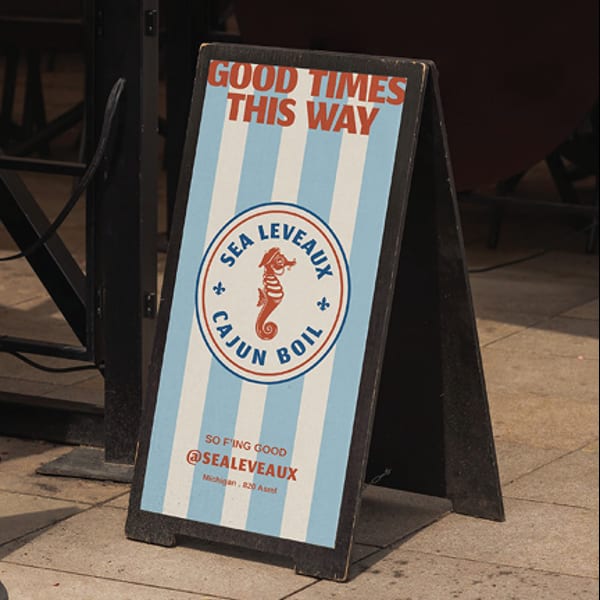 A-frame sign for Sea Leveaux Cajun Boil, with a seahorse logo and "Good Times This Way" text.